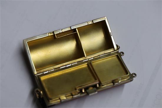 A ladys 1920s silver gilt and gilded red enamelled ovoid minaudiere, import marks for Cohen & Charles, London, 1925, 82mm.